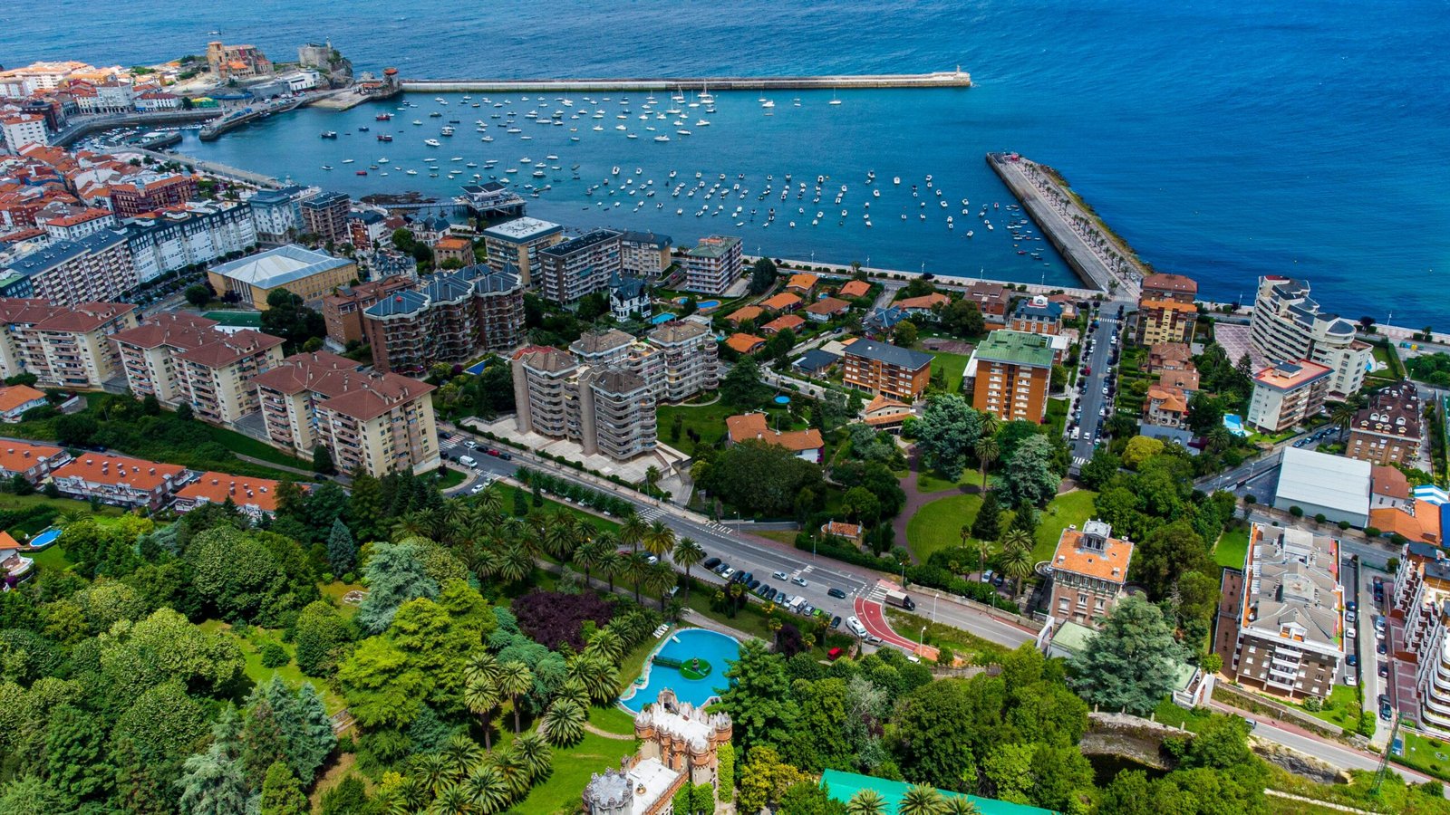 Breathtaking aerial shot of Castro Urdiales, showcasing coastline, buildings, and marina.